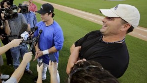 Roger Clemens standing by his son Paul's side during interviews